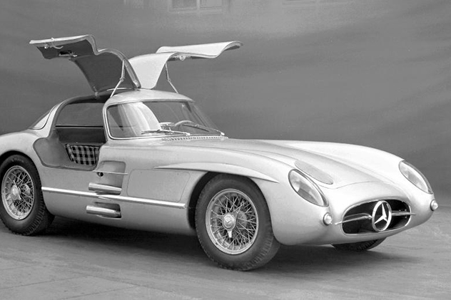 A silver-white Merc 300 with gull wing doors open